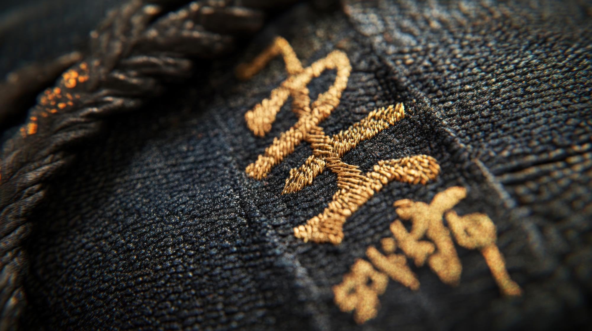 embroidered cuff detail in gold thread